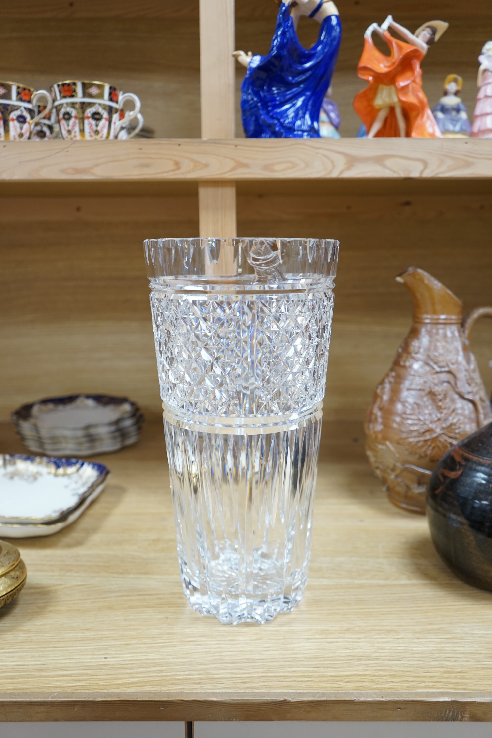 A large Waterford cut glass vase, 35cm high. Condition - chipped to top rim